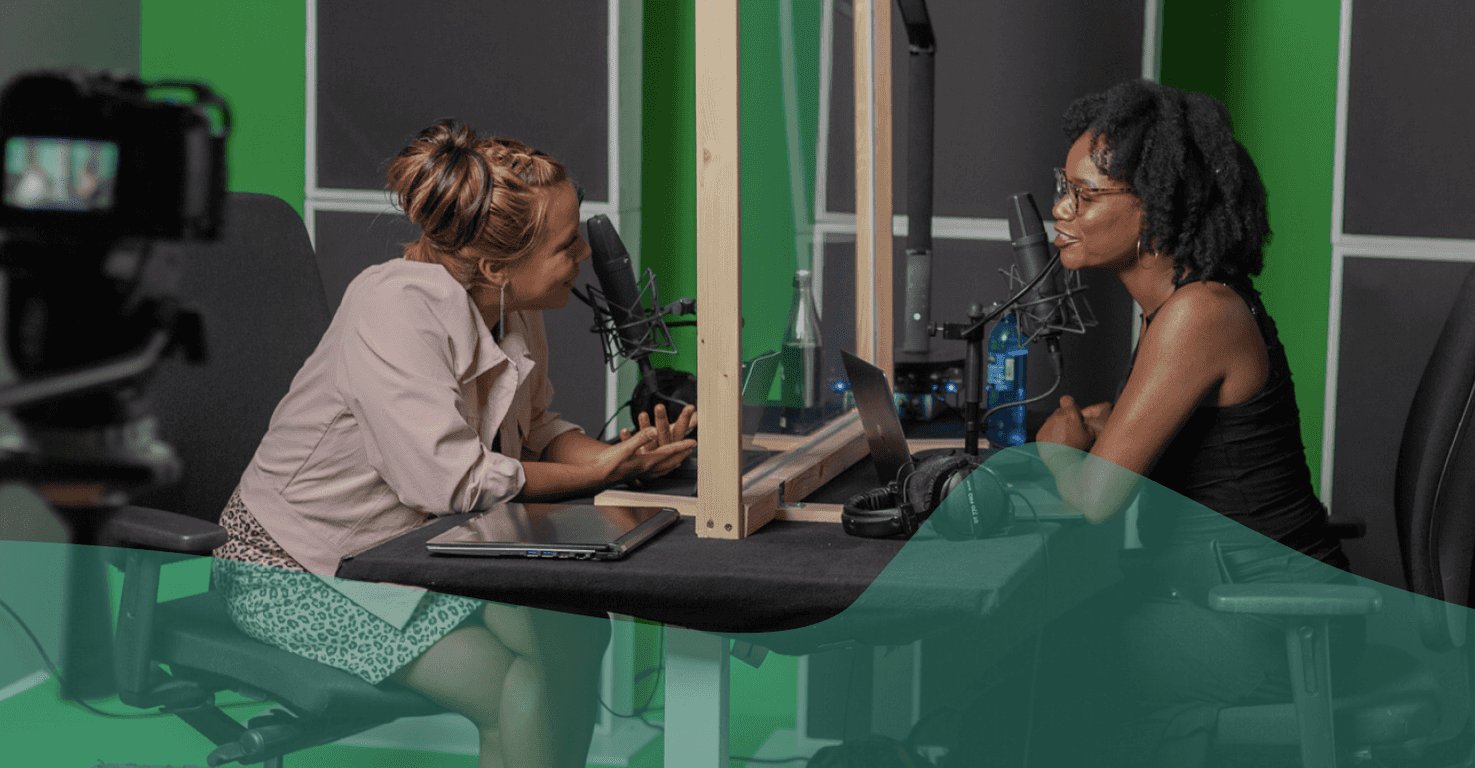 an image of two people recording a podcast in a recording studio