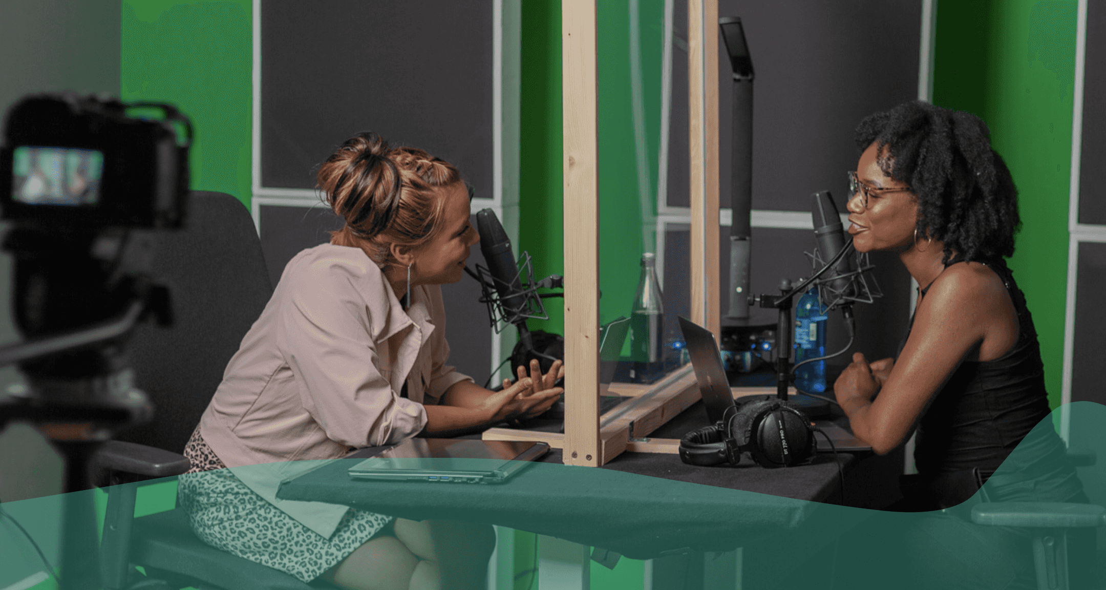 an image of two people recording a podcast in a recording studio